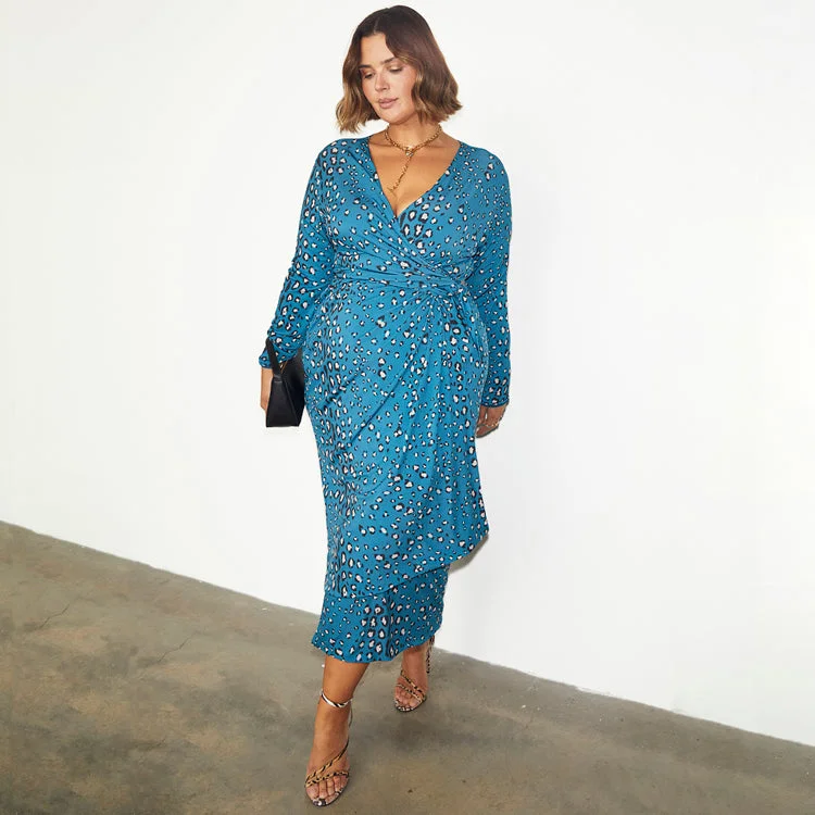 Midi dresses with keyhole backs for a flirty and unexpected detail Reversible Teal Animal Wrap Dress