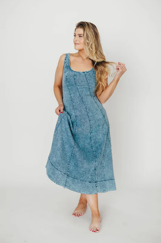 Midi dresses with pom - pom trims for a playful and festive look Abigail Sleeveless Denim Midi Dress in Denim Blue Midi dresses with pom - pom trims for a playful and festive look Abigail Sleeveless Denim Midi Dress in Denim Blue