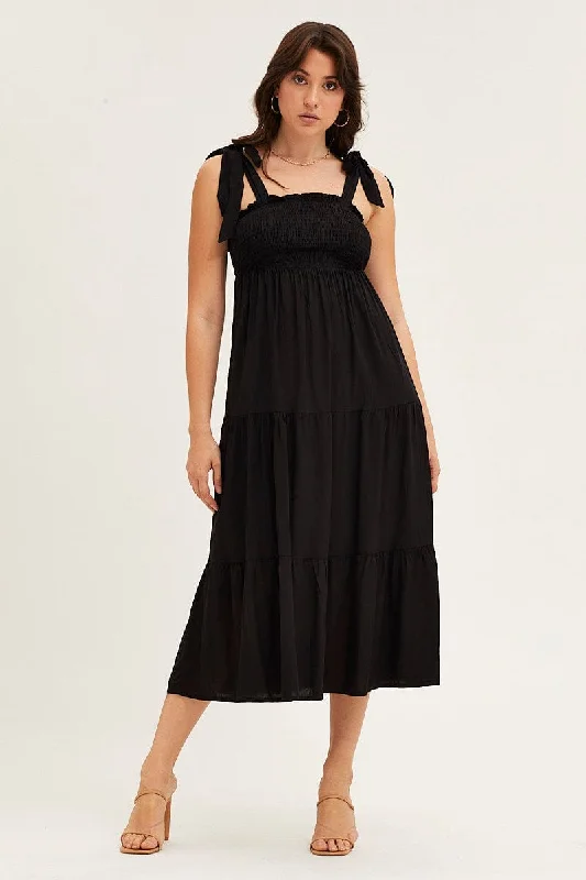 Midi dresses with geometric cutouts for a contemporary and edgy look Black Tied Shoulder Tiered Midi Dress Midi dresses with geometric cutouts for a contemporary and edgy look Black Tied Shoulder Tiered Midi Dress