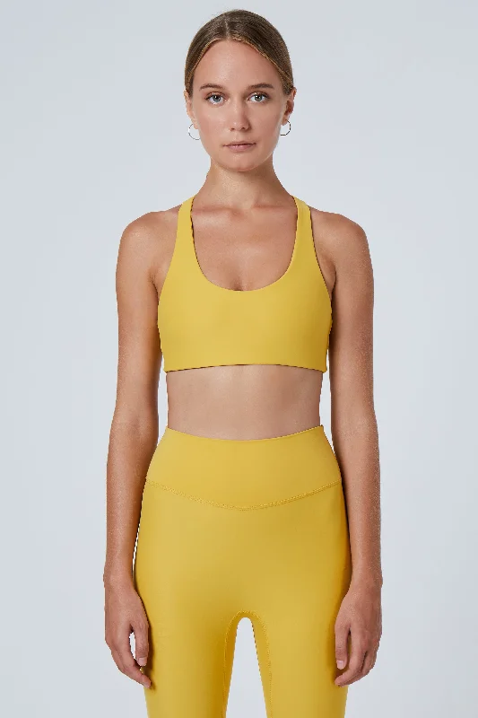 medium impact compression women sport braAlva Racerback Sports Bra | Recycled Nylon | Mustard medium impact compression women sport braAlva Racerback Sports Bra | Recycled Nylon | Mustard